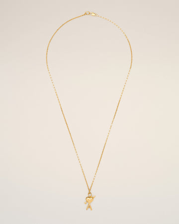 Gold brass necklace with hammered Ami de Coeur arrow