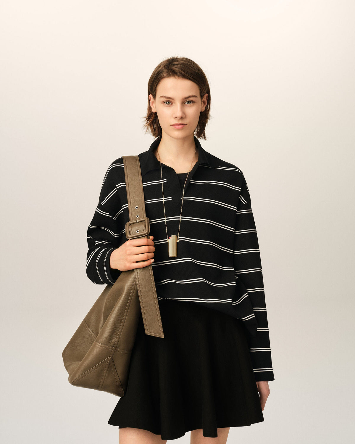 Black striped cotton polo with Ami patch